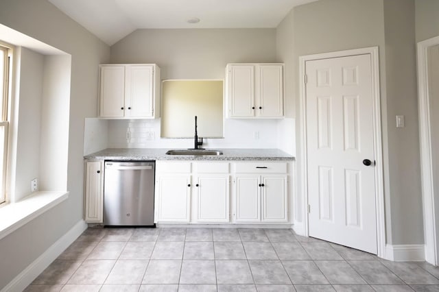 238 Almond Dr, Lake Jackson, TX 77566 - kitchen featuring dishwasher, decorative backsplash, white cabinets, light tile patterned floors, and vaulted ceiling