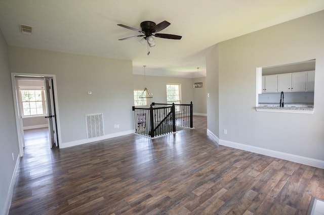 238 Almond Dr, Lake Jackson, TX 77566 - spare room featuring healthy amount of natural light, ceiling fan, and dark wood-style floors