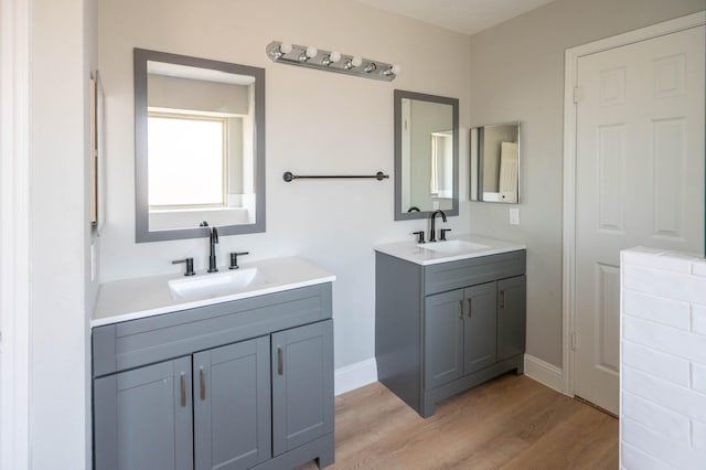 238 Almond Dr, Lake Jackson, TX 77566 - full bath with two vanities and wood finished floors