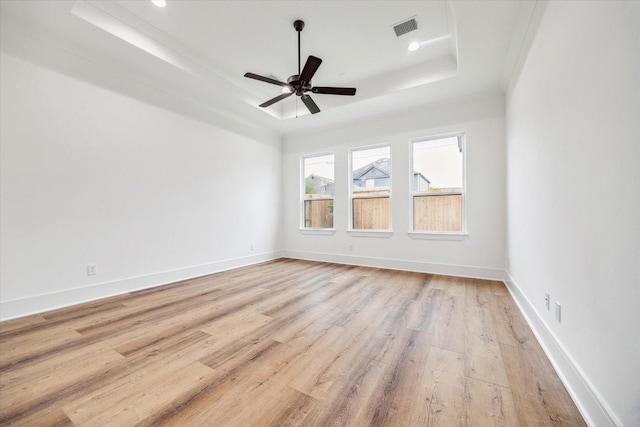 3314 Arbor St, Houston, TX 77004 - empty room featuring a tray ceiling, light wood finished floors, a ceiling fan, and recessed lighting