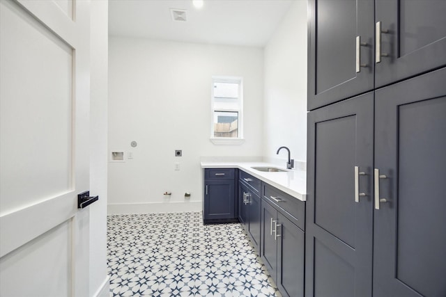 3314 Arbor St, Houston, TX 77004 - washroom with cabinet space, light flooring, electric dryer hookup, and washer hookup