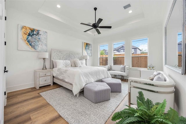 3314 Arbor St, Houston, TX 77004 - bedroom with a tray ceiling, wood finished floors, recessed lighting, and a ceiling fan