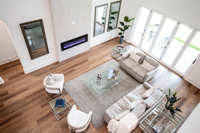 3314 Arbor St, Houston, TX 77004 - living area featuring wood finished floors and a tile fireplace