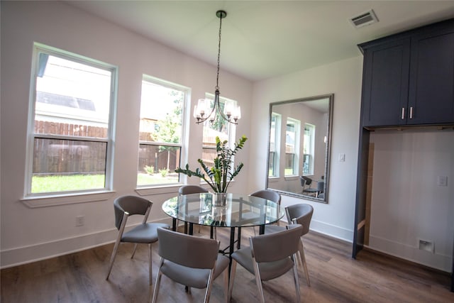 3314 Arbor St, Houston, TX 77004 - dining space featuring healthy amount of natural light, dark wood-style flooring, and a chandelier