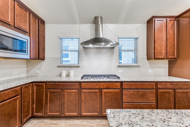 2821 Redbud Ln, Melissa, TX 75454 - kitchen with wall chimney range hood, appliances with stainless steel finishes, plenty of natural light, and decorative backsplash