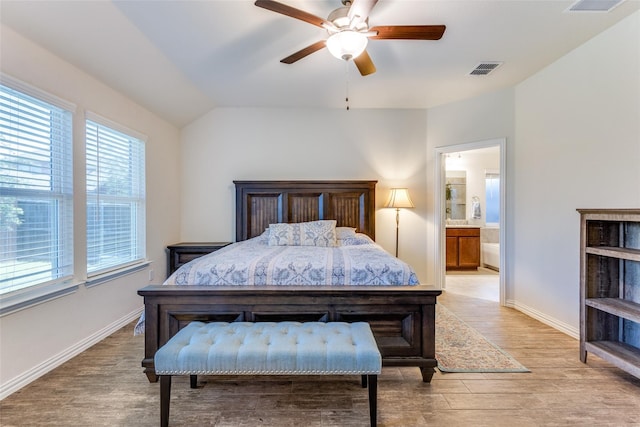 2821 Redbud Ln, Melissa, TX 75454 - bedroom featuring light wood-style flooring, connected bathroom, a ceiling fan, and vaulted ceiling