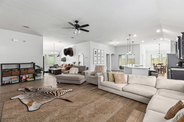 5311 Latigo Ct, Alvin, TX 77511 - living room with a ceiling fan, plenty of natural light, recessed lighting, wood finished floors, and lofted ceiling