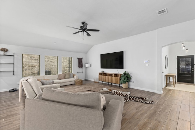 5311 Latigo Ct, Alvin, TX 77511 - living room with ceiling fan, wood finished floors, lofted ceiling, and arched walkways