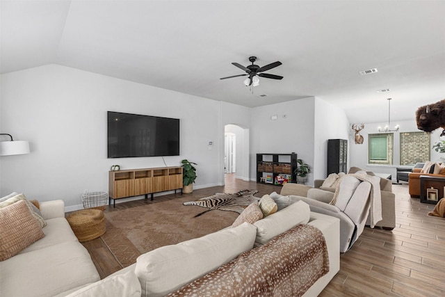 5311 Latigo Ct, Alvin, TX 77511 - living room with arched walkways, ceiling fan, a chandelier, wood finished floors, and lofted ceiling