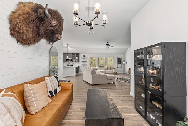 5311 Latigo Ct, Alvin, TX 77511 - living area featuring a chandelier, wood finished floors, and a ceiling fan