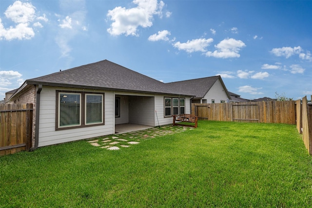 5311 Latigo Ct, Alvin, TX 77511 - rear view of house featuring roof with shingles, a fenced backyard, and a patio area