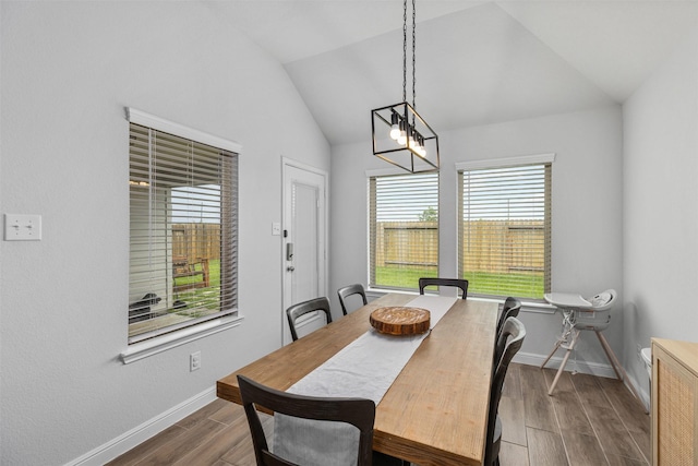 5311 Latigo Ct, Alvin, TX 77511 - dining room with dark wood-type flooring and lofted ceiling