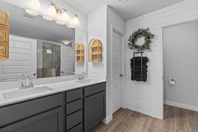 5311 Latigo Ct, Alvin, TX 77511 - full bath with a stall shower, double vanity, and wood finished floors