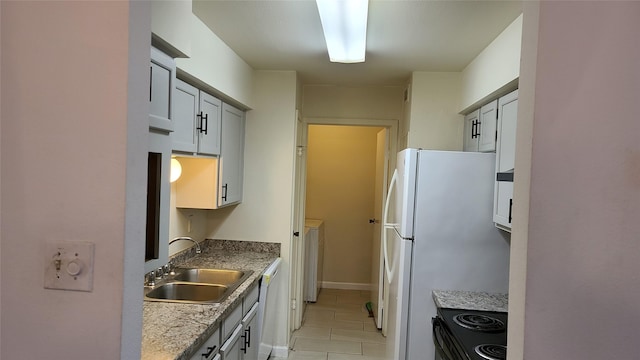 8787 Brae Acres Rd Unit 104, Houston, TX 77074 - kitchen featuring white appliances and light tile patterned floors