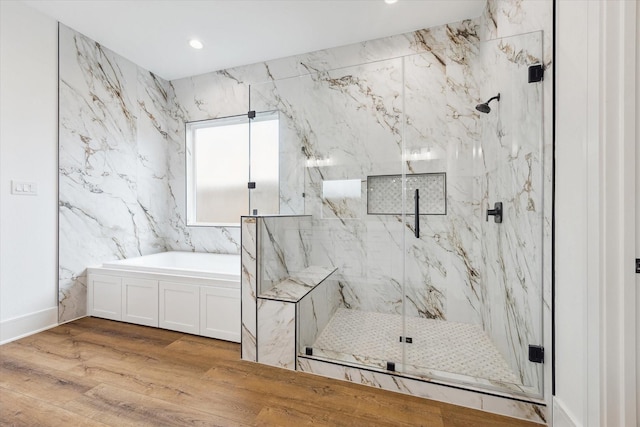 3312 Arbor St, Houston, TX 77004 - bathroom featuring a marble finish shower, a bath, wood finished floors, and recessed lighting