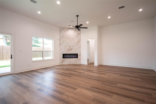 3312 Arbor St, Houston, TX 77004 - unfurnished living room featuring ceiling fan, recessed lighting, wood finished floors, and a high end fireplace