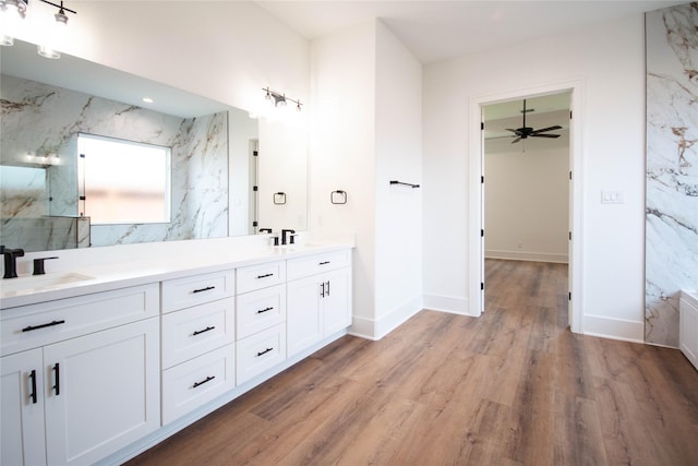 3312 Arbor St, Houston, TX 77004 - full bathroom featuring double vanity, wood finished floors, a marble finish shower, and ceiling fan