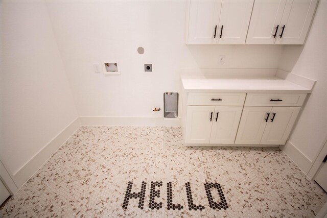 3312 Arbor St, Houston, TX 77004 - laundry area with hookup for an electric dryer, cabinet space, and gas dryer hookup