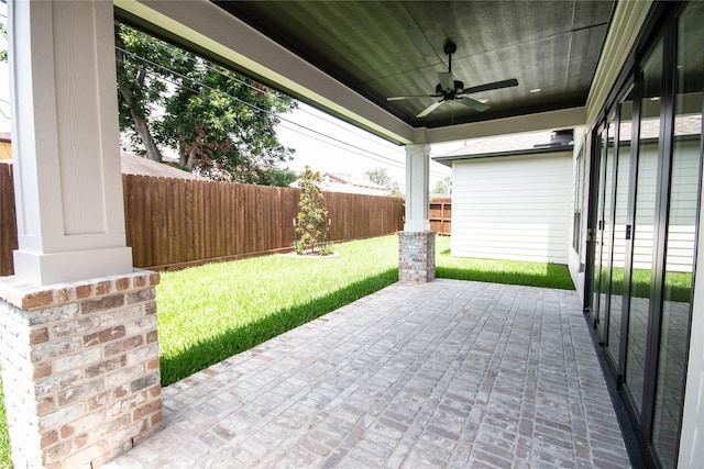 3312 Arbor St, Houston, TX 77004 - fenced backyard with ceiling fan and a patio