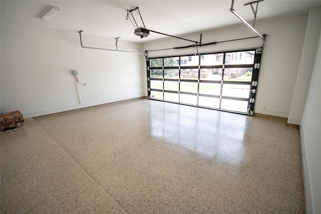 3312 Arbor St, Houston, TX 77004 - garage featuring a garage door opener and baseboards
