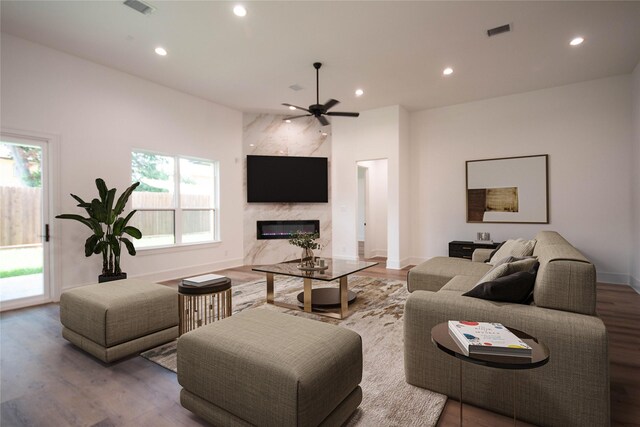 3312 Arbor St, Houston, TX 77004 - living room with a ceiling fan, a high end fireplace, recessed lighting, and wood finished floors