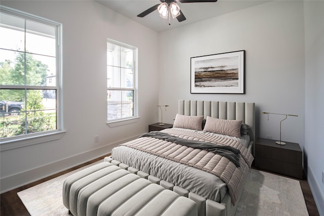3312 Arbor St, Houston, TX 77004 - bedroom featuring multiple windows, dark wood-type flooring, and a ceiling fan
