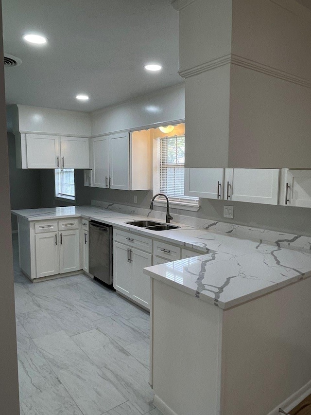 2202 Mockingbird Ln, Baytown, TX 77520 - kitchen with dishwasher, a peninsula, white cabinetry, and recessed lighting