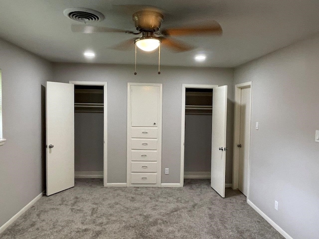 2202 Mockingbird Ln, Baytown, TX 77520 - unfurnished bedroom featuring multiple closets, carpet flooring, ceiling fan, and recessed lighting