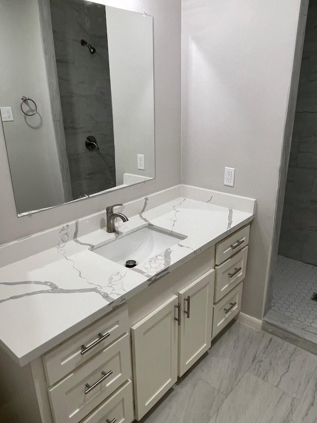 2202 Mockingbird Ln, Baytown, TX 77520 - bathroom featuring vanity, a shower stall, and marble finish floors