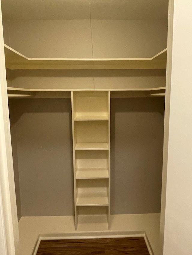 2202 Mockingbird Ln, Baytown, TX 77520 - walk in closet with wood finished floors