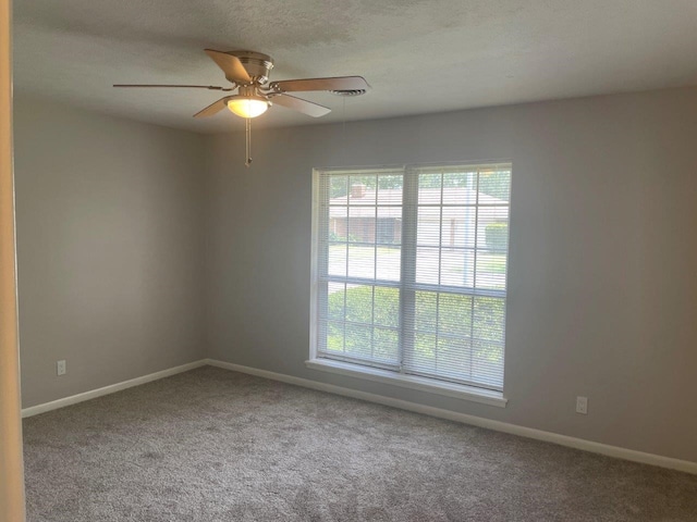2202 Mockingbird Ln, Baytown, TX 77520 - carpeted spare room with baseboards and a ceiling fan