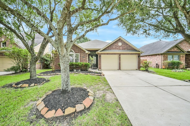 2531 Llano Springs Dr, Katy, TX 77494 - view of front of house with a garage, brick siding, a front lawn, and concrete driveway