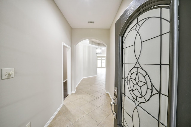 2531 Llano Springs Dr, Katy, TX 77494 - corridor featuring arched walkways and light tile patterned floors
