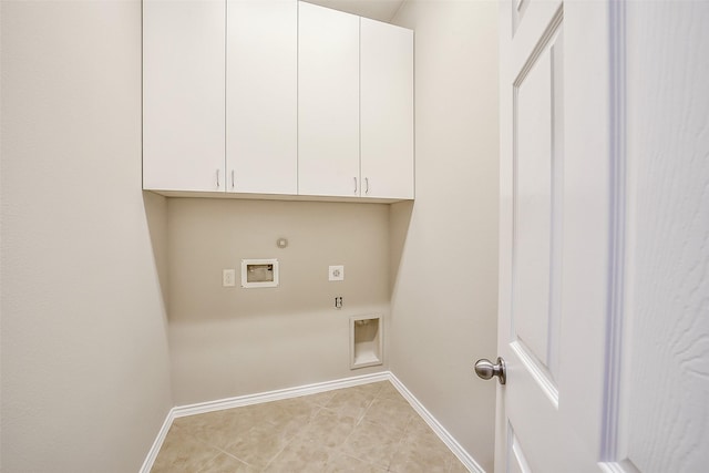 2531 Llano Springs Dr, Katy, TX 77494 - washroom with hookup for an electric dryer, hookup for a gas dryer, cabinet space, washer hookup, and light tile patterned flooring