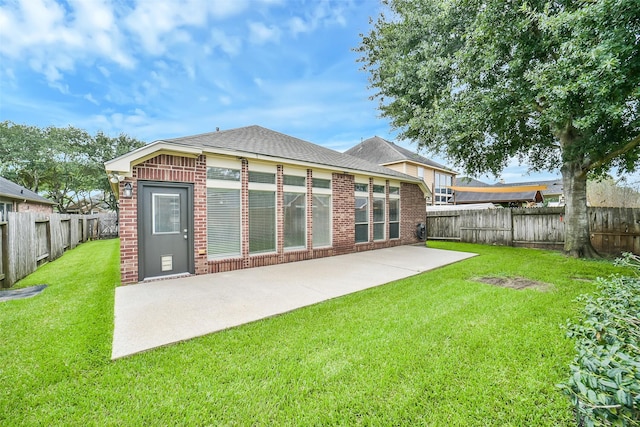 2531 Llano Springs Dr, Katy, TX 77494 - rear view of property featuring brick siding, a fenced backyard, and a patio area