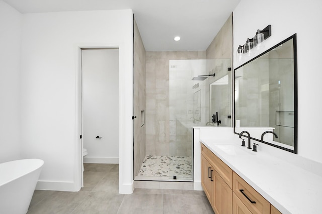 1913 W St, Houston, TX 77026 - bathroom with a shower stall, vanity, tile patterned floors, a freestanding bath, and recessed lighting