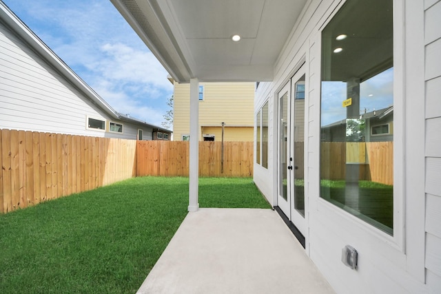 1913 W St, Houston, TX 77026 - fenced backyard with french doors and a patio area