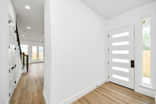 1913 W St, Houston, TX 77026 - entryway featuring light wood-style flooring and recessed lighting