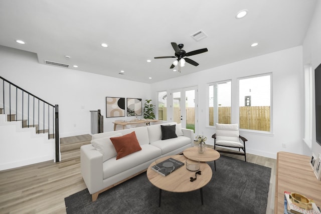 1913 W St, Houston, TX 77026 - living area with light wood-type flooring, recessed lighting, stairway, french doors, and a ceiling fan