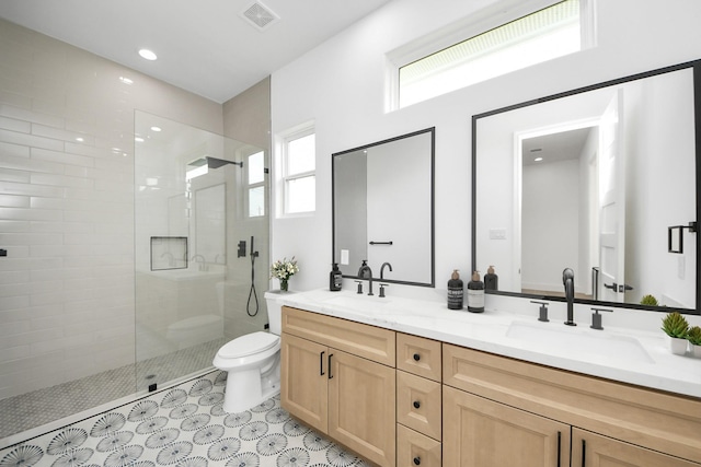 1913 W St, Houston, TX 77026 - bathroom featuring double vanity and walk in shower