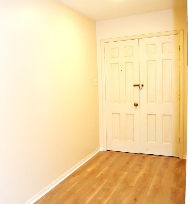 101 Summit Dr, Conroe, TX 77303 - doorway with baseboards and light wood-style floors