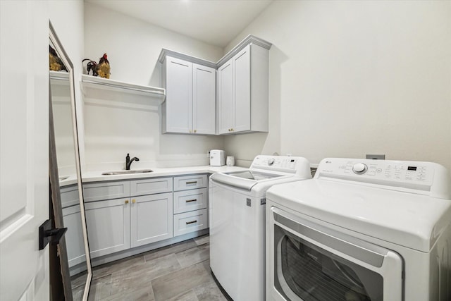 824 Wakefield Dr Unit A, Houston, TX 77018 - washroom featuring washer and clothes dryer and cabinet space