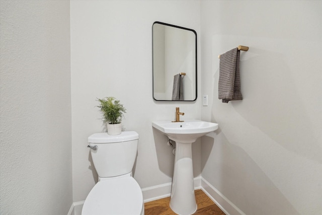 824 Wakefield Dr Unit A, Houston, TX 77018 - bathroom featuring baseboards and toilet