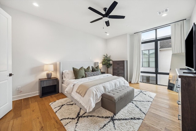 824 Wakefield Dr Unit A, Houston, TX 77018 - bedroom featuring light wood-style flooring, ceiling fan, and recessed lighting