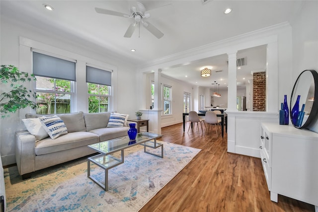 724 E 21st St, Houston, TX 77008 - living area featuring decorative columns, crown molding, light wood-style floors, ceiling fan, and recessed lighting