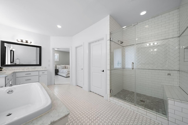 8421 Moritz Grn, Houston, TX 77055 - full bath featuring ensuite bathroom, a stall shower, a bath, vanity, and tile patterned flooring
