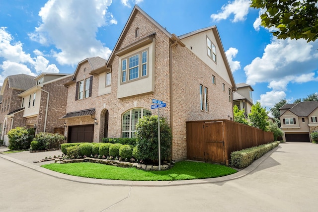 8421 Moritz Grn, Houston, TX 77055 - multi unit property featuring a garage, a residential view, stucco siding, and brick siding