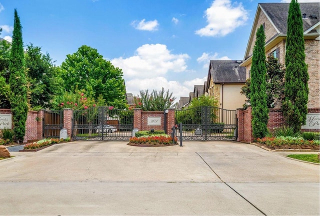 8421 Moritz Grn, Houston, TX 77055 - view of concrete street with a gate, a gated entry, and curbs