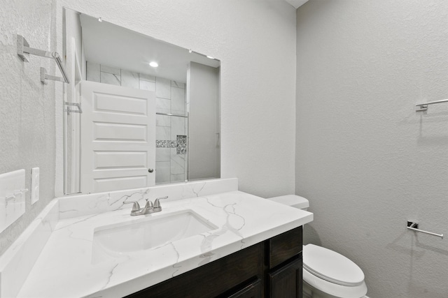 5118 Danfield Dr, Houston, TX 77053 - full bathroom featuring vanity, a textured wall, and tiled shower
