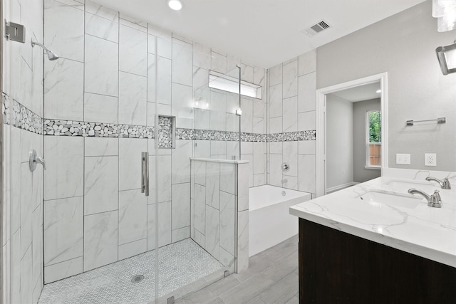 5118 Danfield Dr, Houston, TX 77053 - bathroom featuring a stall shower, a bathtub, vanity, and recessed lighting